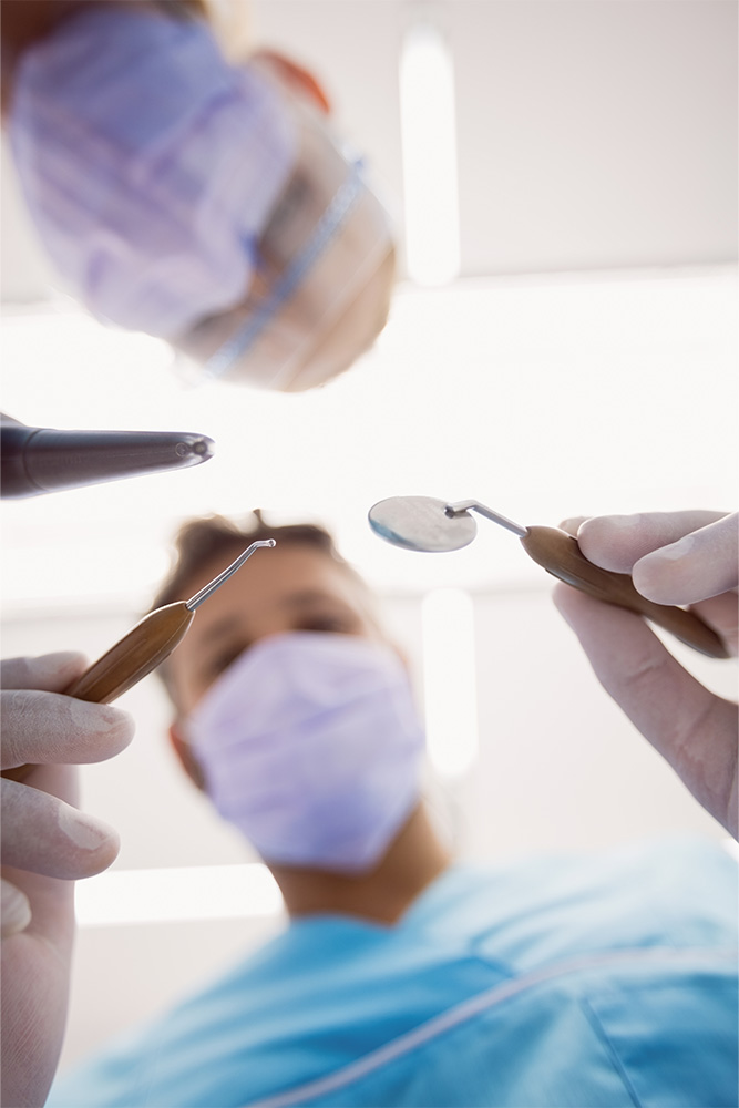 tpd_dentists-holding-dental-tools